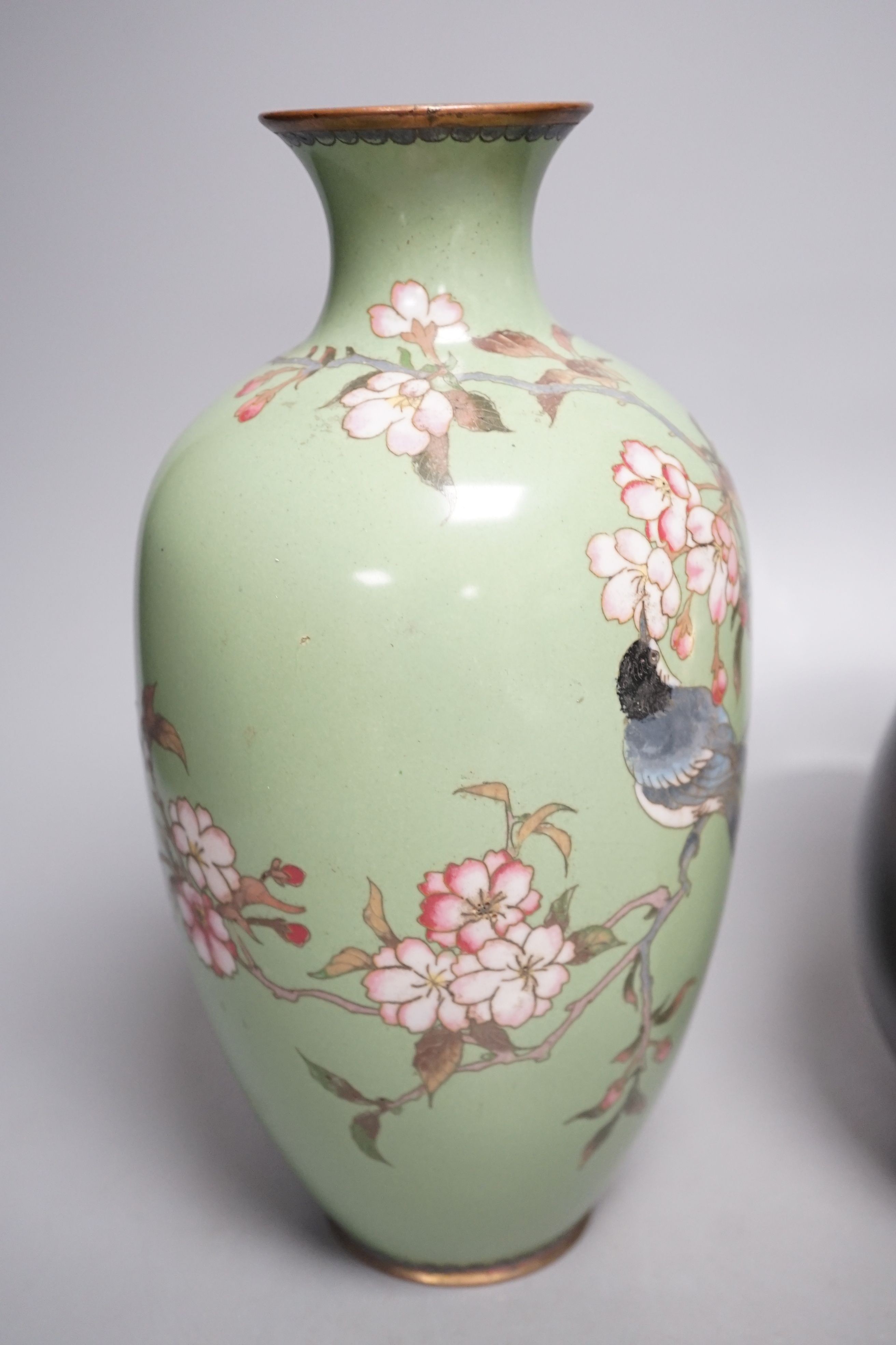 A Japanese cloisonné enamel vase and a Japanese mixed metal vase, cloisonné vase 25 cms high.